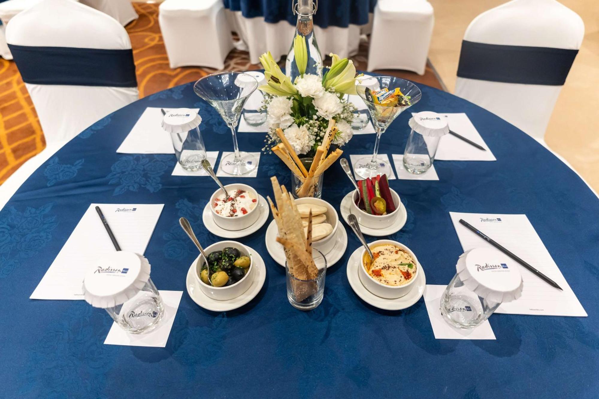 Radisson Blu Hotel, Greater Noida Bagian luar foto A table set for a meeting